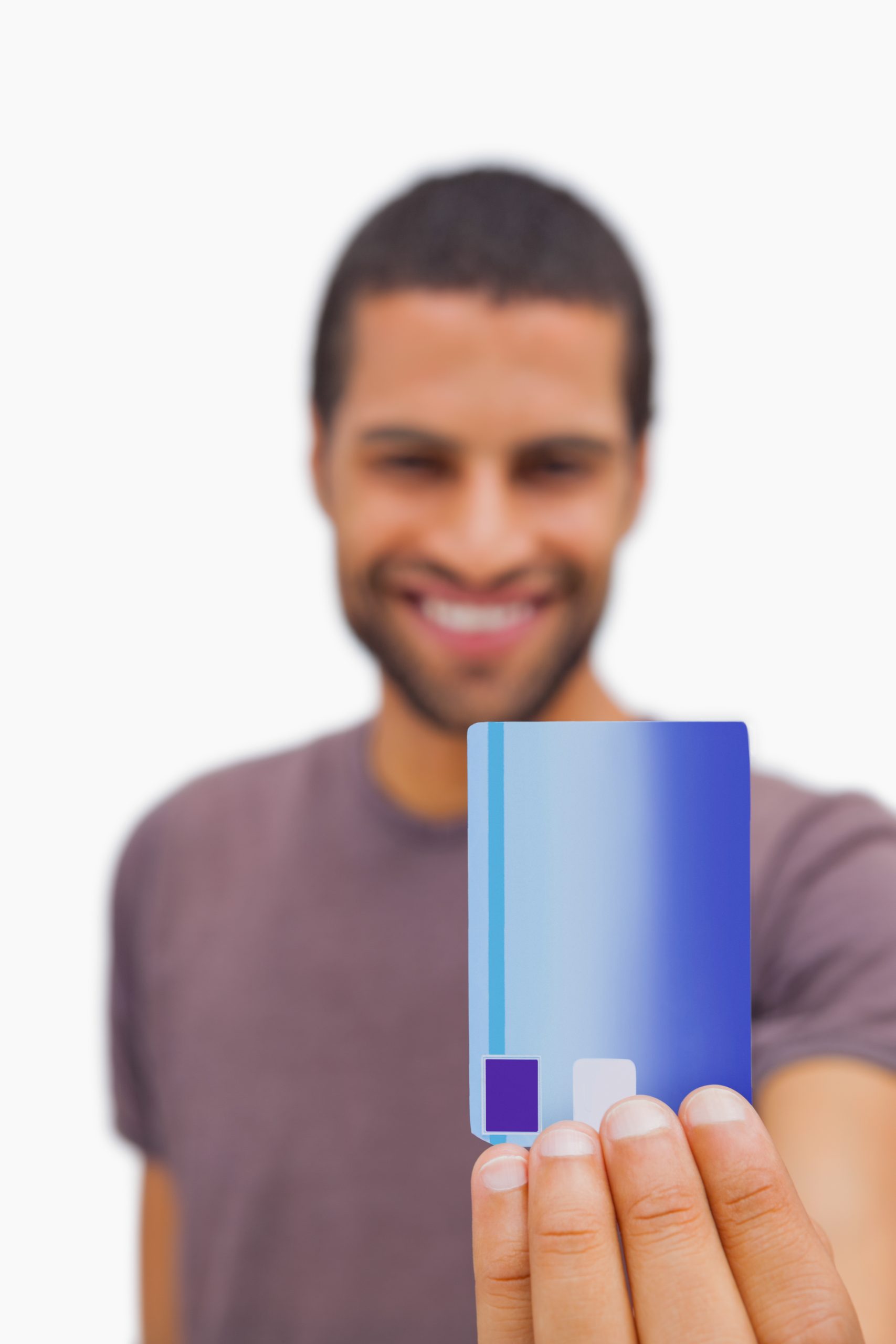 Handsome man showing credit card on white background